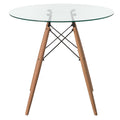 Tavolo da pranzo con piano rotondo in vetro e gambe in legno